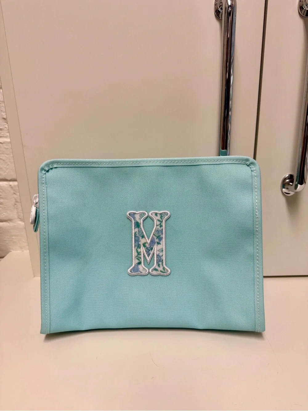TRVL Design Turquoise Monogram Cosmetic Pouch with Decorative 'M'